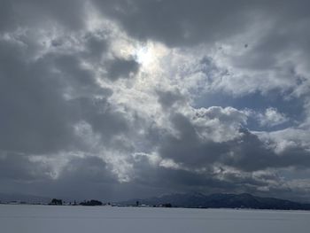 Scenic view of clouds over mountain against sky