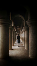 Man walking in archway