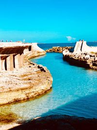 Scenic view of sea against blue sky