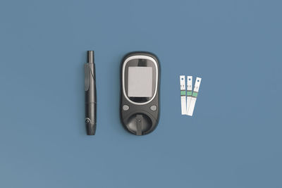 Directly above shot of usb stick against blue background