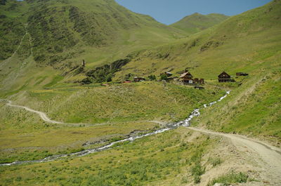 Scenic view of green landscape and mountains