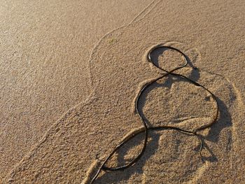 High angle view of shadow on sand