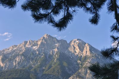 Low angle view of majestic mountains against sky