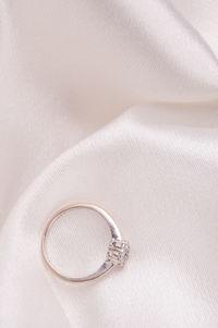 High angle view of wedding rings on metal
