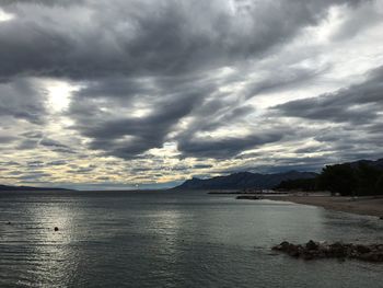 Scenic view of sea against cloudy sky