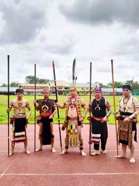 Group of people standing against the sky