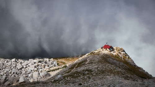 Low angle view of snowcapped mountain against sky