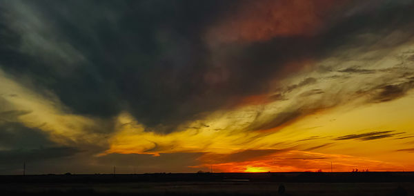 Scenic view of dramatic sky during sunset