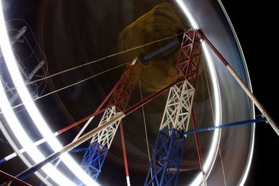 Low angle view of basketball hoop at night