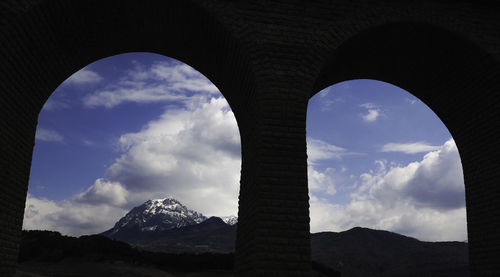 Low angle view of arch bridge against sky