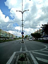 City street against cloudy sky