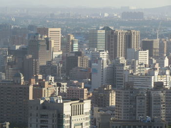 High angle view of buildings in city against sky