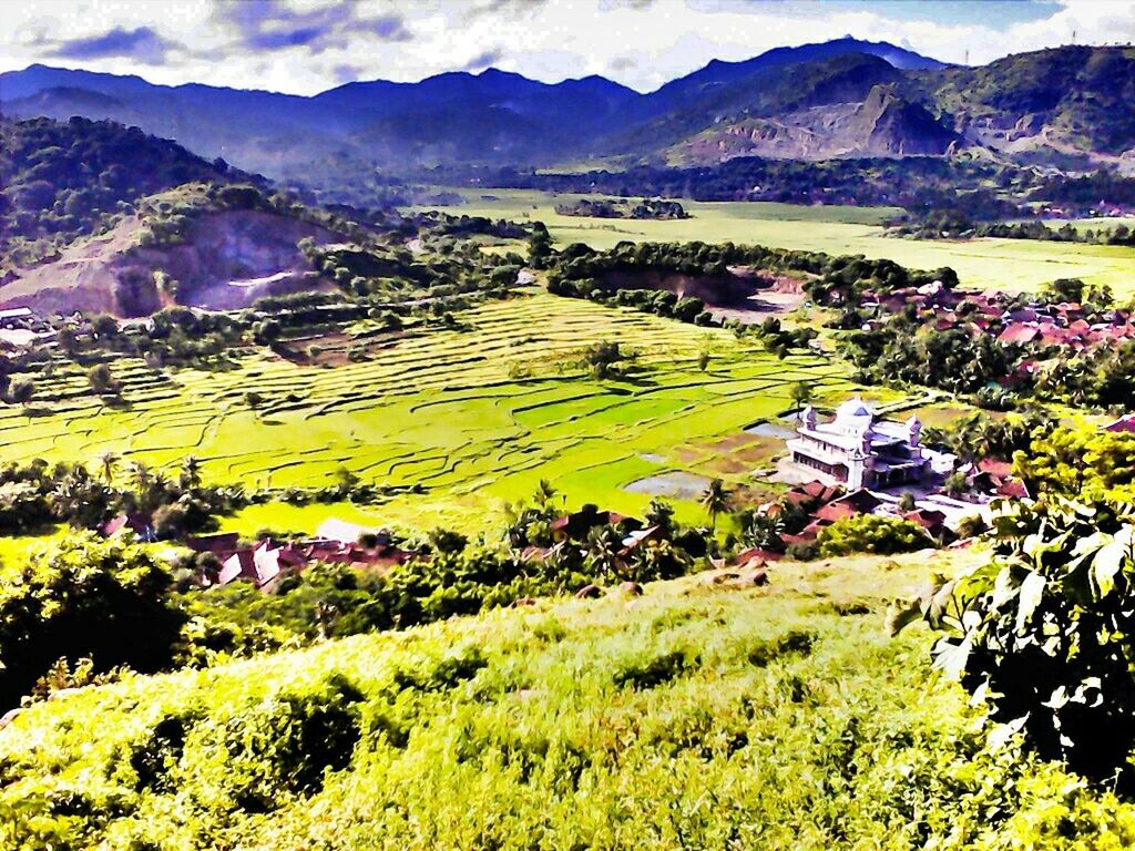 mountain, landscape, rural scene, tranquil scene, beauty in nature, agriculture, scenics, mountain range, tranquility, field, nature, farm, high angle view, green color, growth, crop, hill, idyllic, village, non-urban scene