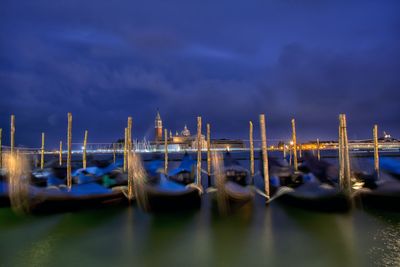 Sailboats moored in sea