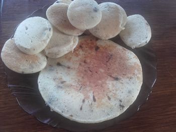 Close-up overhead view of bread on wooden table