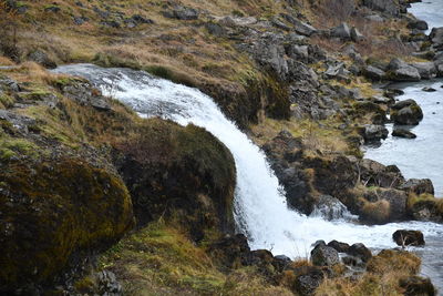 Scenic view of stream flowing through rocks