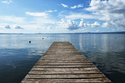 Pier over sea against sky