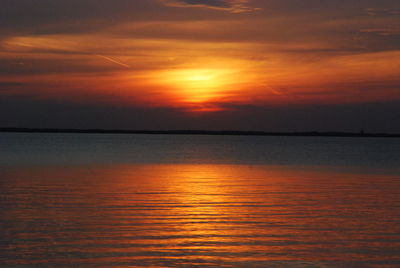 Scenic view of sea against romantic sky at sunset