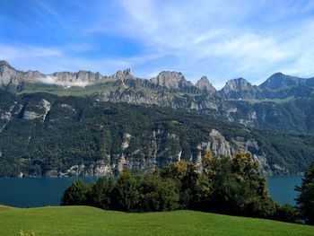 Scenic view of landscape and mountains against sky