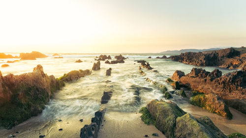 Scenic view of sea against sky during sunset