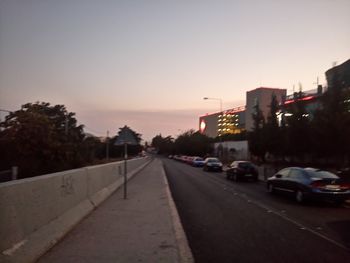 Cars on road in front of buildings