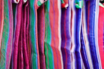 Full frame shot of multi colored shopping bags hanging at market stall