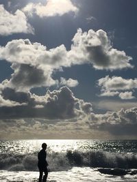 Man looking at sea against sky