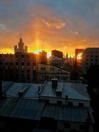 Cityscape against sky during sunset