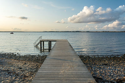 Pier over sea against sky