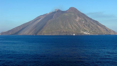 Scenic view of sea against blue sky