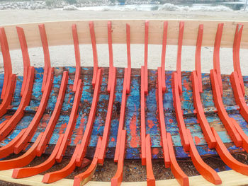 High angle view of empty chairs at beach