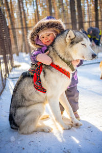 Portrait of young woman with dog