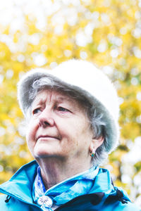 Portrait of mid adult man against blurred trees