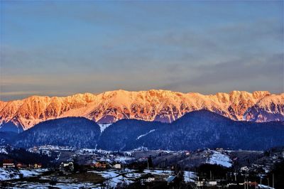 Close-up of snow covered mountain against sky