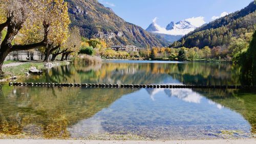 Scenic view of lake and mountains against sky