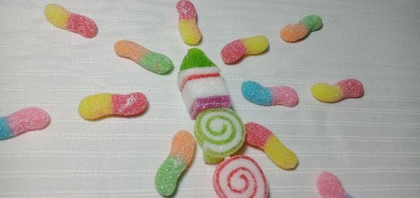 High angle view of multi colored candies on table