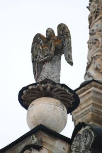 Low angle view of statue against sky