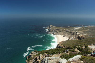 High angle view of sea against clear blue sky