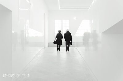 People walking in corridor