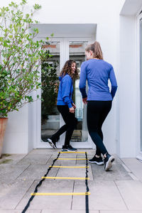 Women walking while exercising on floor