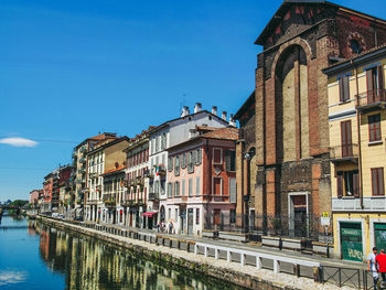 Buildings against blue sky in city