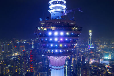 Illuminated buildings in city at night