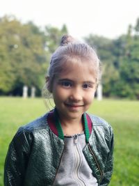 Portrait of smiling boy on field
