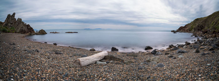 Panoramic shot of sea against cloudy sky