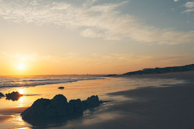 Scenic view of sea at sunset