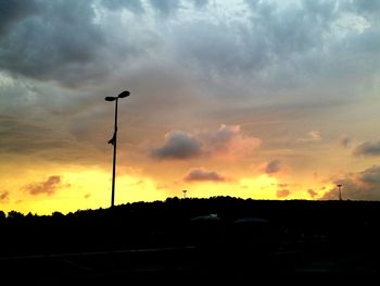 Silhouette of landscape against dramatic sky