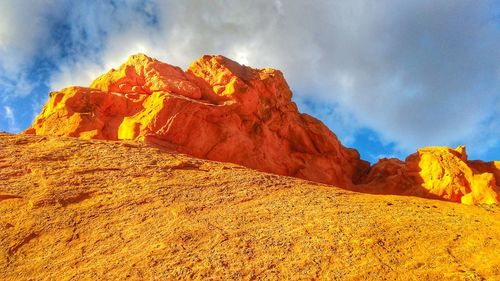 Low angle view of rock formation against sky