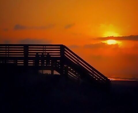 SILHOUETTE BRIDGE AGAINST DRAMATIC SKY