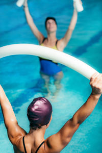 High angle view of woman swimming in pool