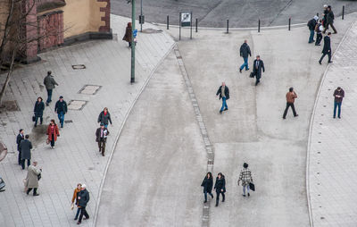 High angle view of people walking in city